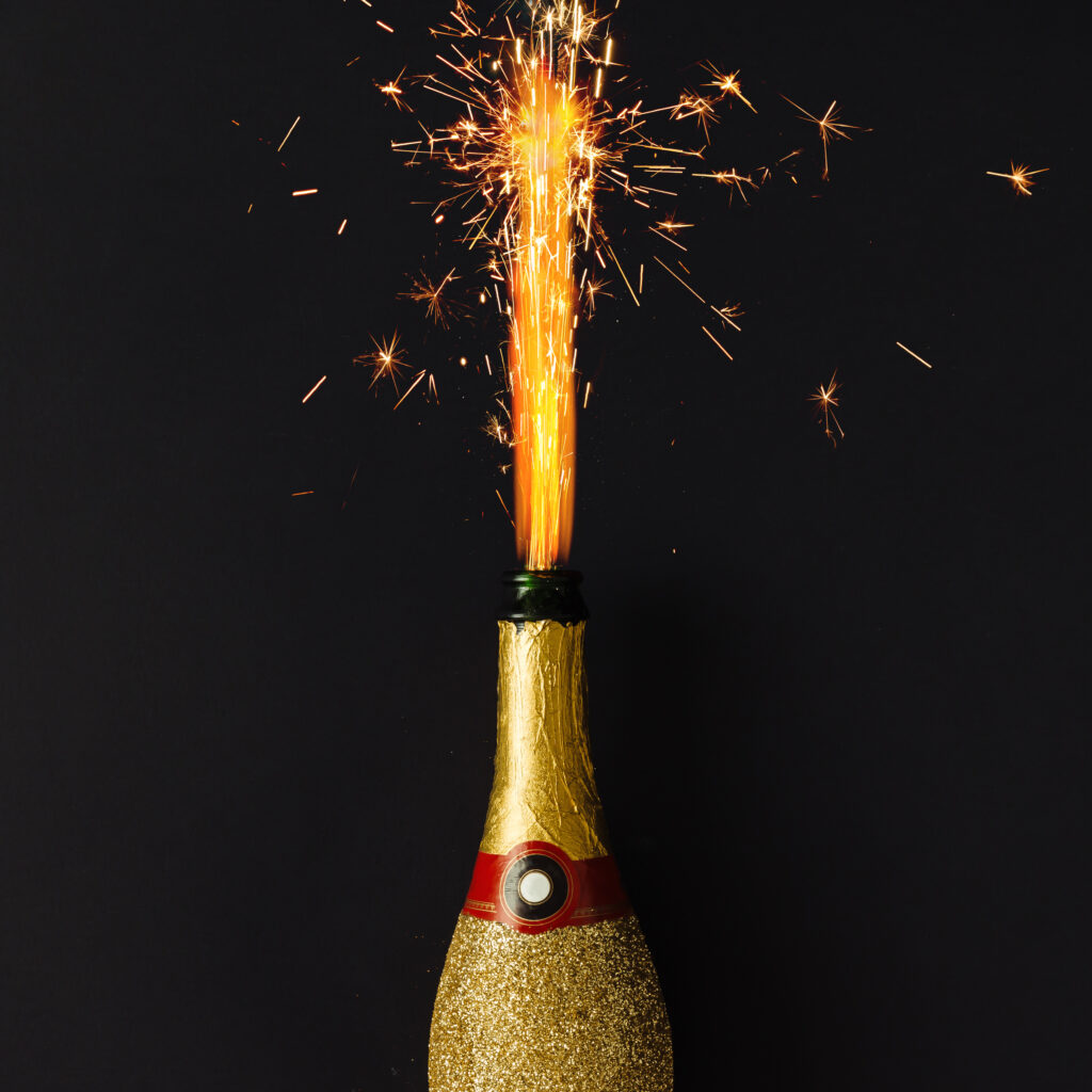 stock photo of Champange bottle with fireworks 